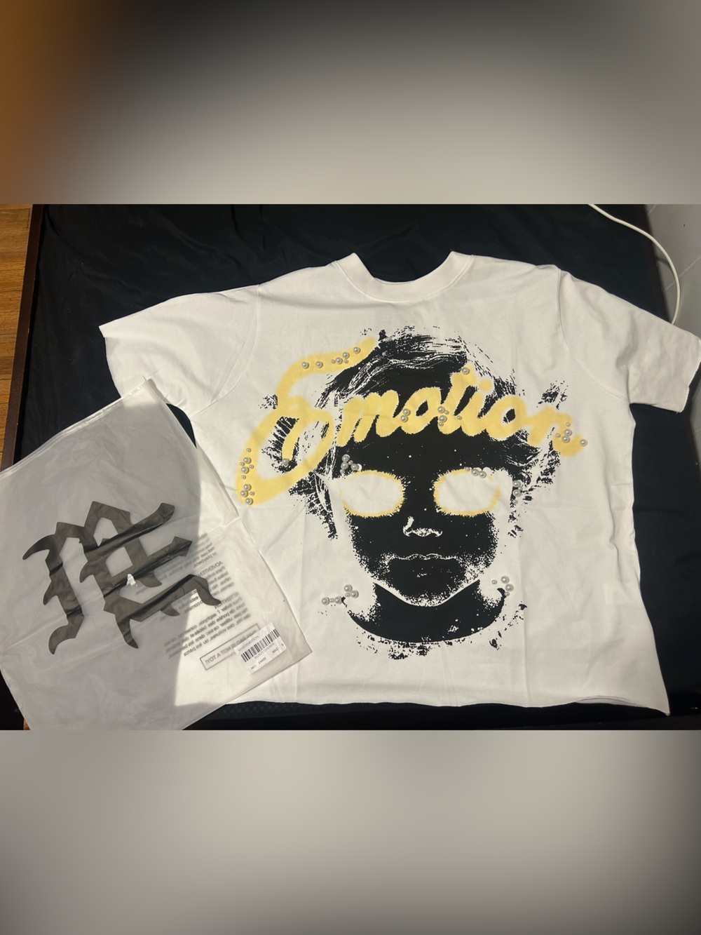 White Short-Sleeve Graphic Tee with Yellow Accents